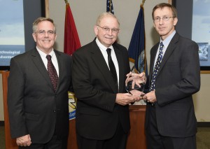 150717-N-PO203-051 ARLINGTON, Virginia (July 17, 2015) Jere Glover, center, executive director, small business technology council and Robert Smith, director, Department of the Navy SBIR/STTR programs, present Sean J. Stackley, assistant secretary of the Navy for research, development and acquisition, with an award for his support of SBIR/STTR during a brief ceremony held at the Office of Naval Research. (U.S. Navy photo by John F. Williams/Released)